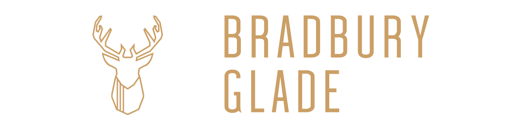 Wonderland Wedding Venues | A minimalist logo featuring a stylized illustration of a deer's head drawn with geometric lines on the left. To the right, the text "BRADBURY GLADE" is written in all caps with a modern, sans-serif font. The design uses a golden color on a green background.